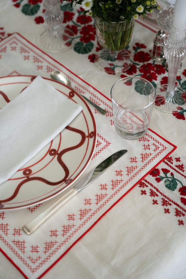 rectangular ivory and red embroidered placemat corner detail
