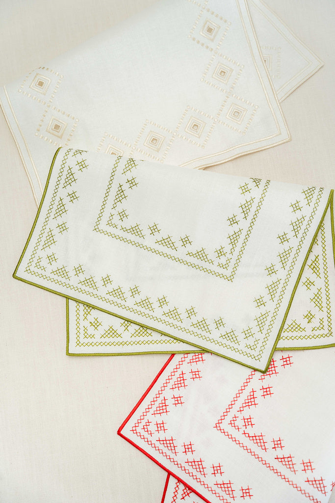 rectangular ivory and red embroidered placemat folded