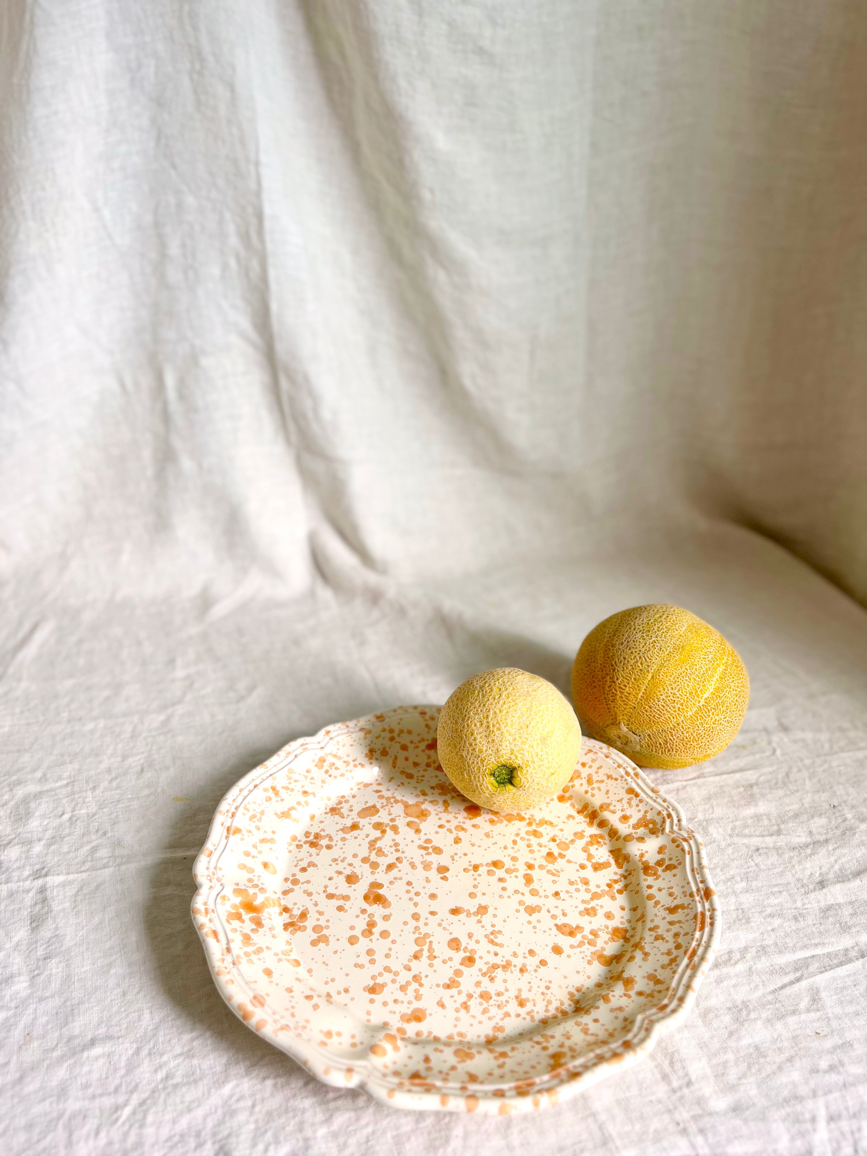 brown and white round spatterware platter 14" with tomatoes