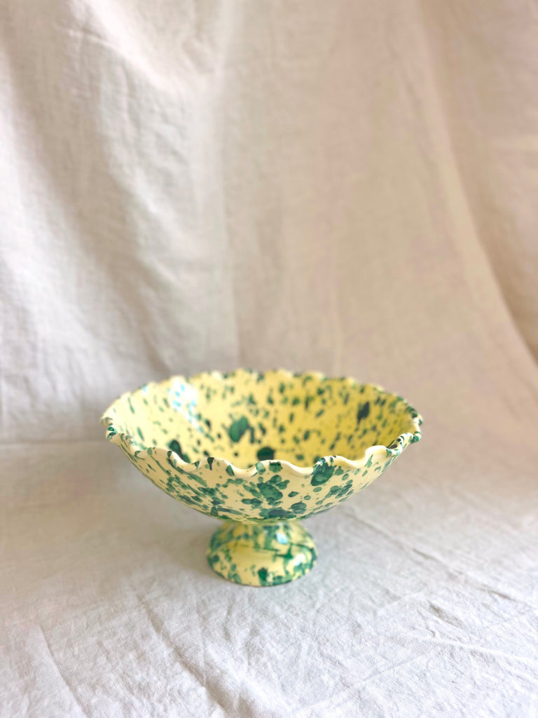 green and cream spatterware compote bowl on table