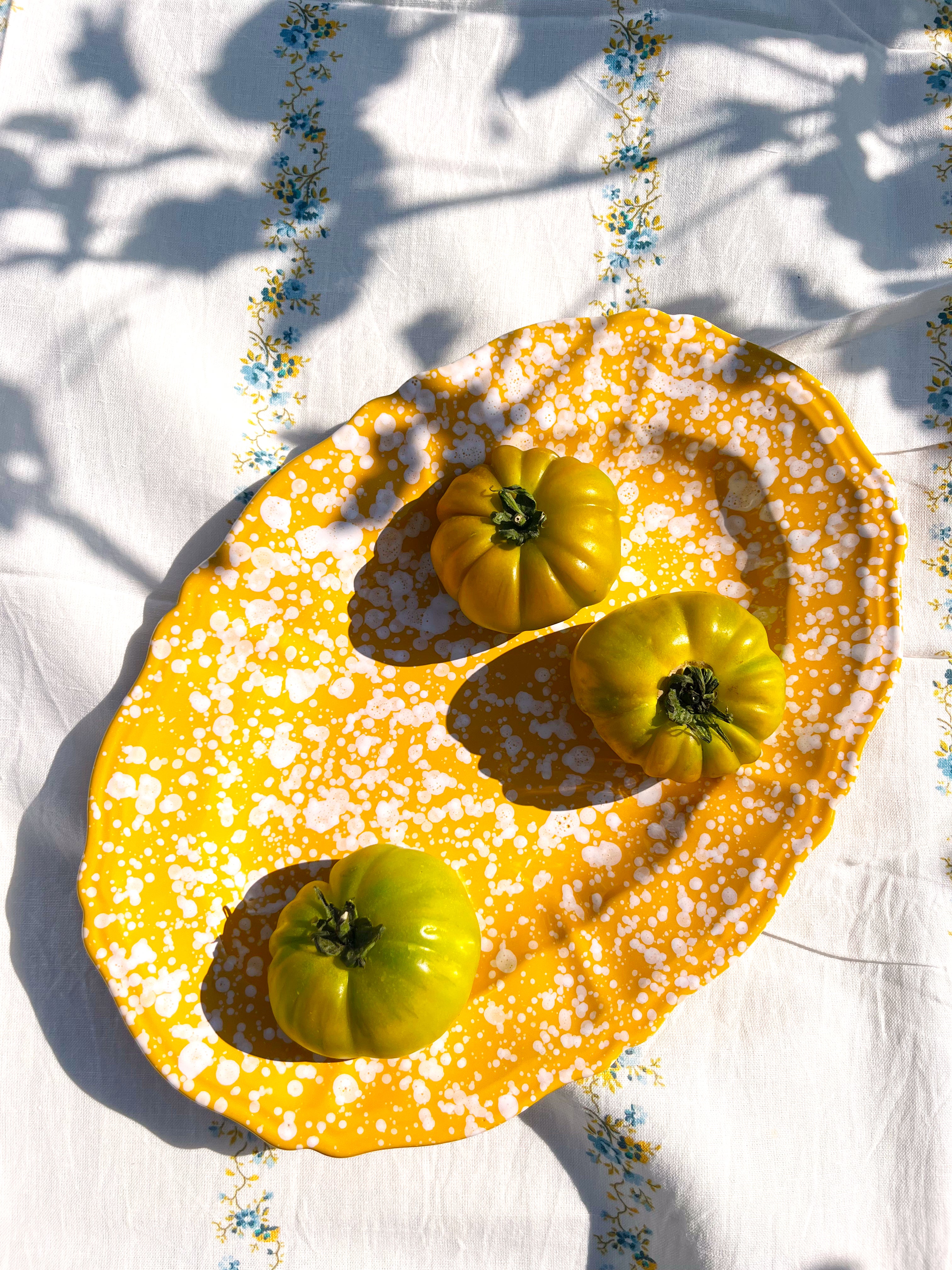 yellow and white oval spatterware platter 14" top view