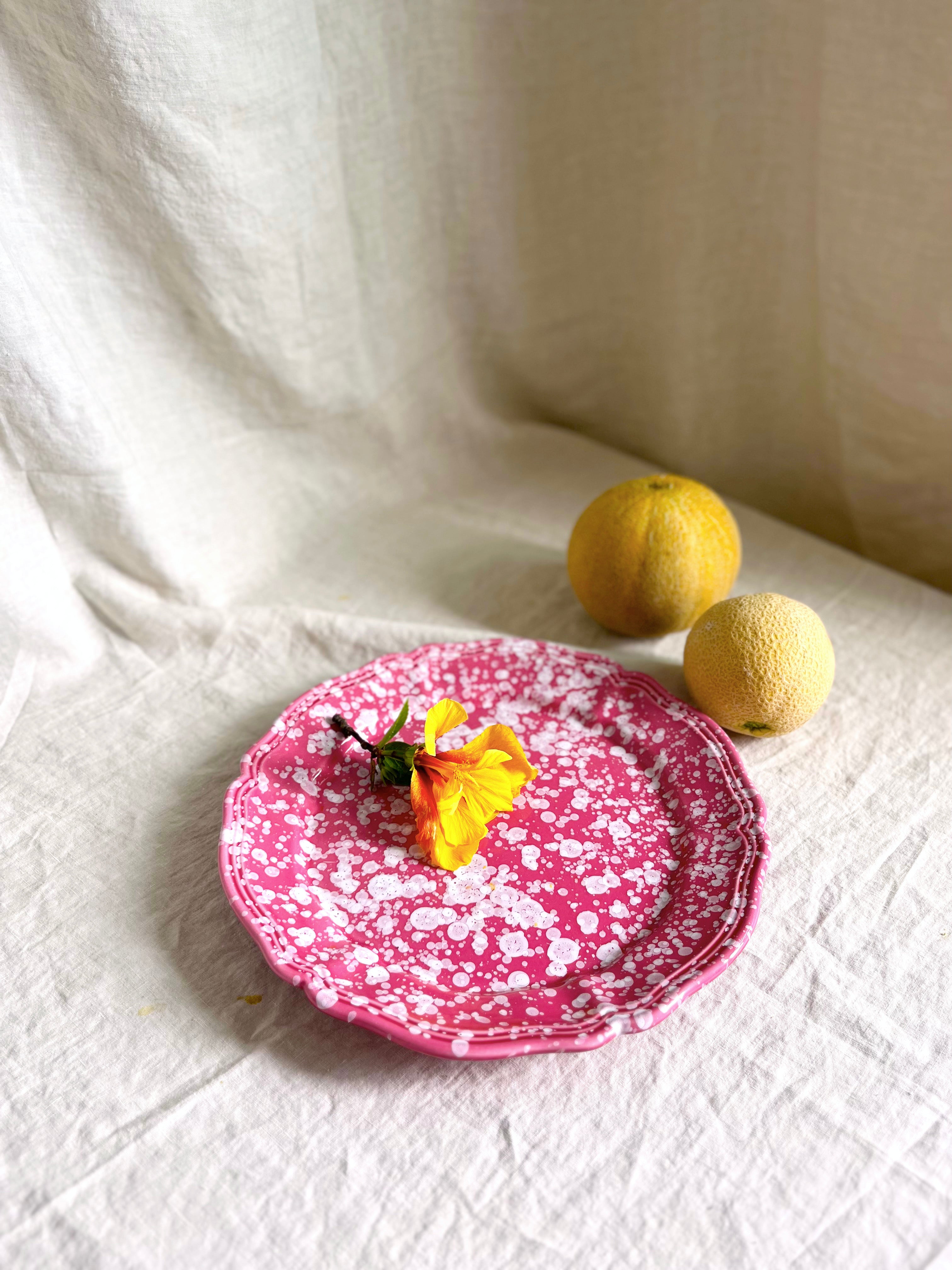 pink and white round spatterware platter 14" with flower