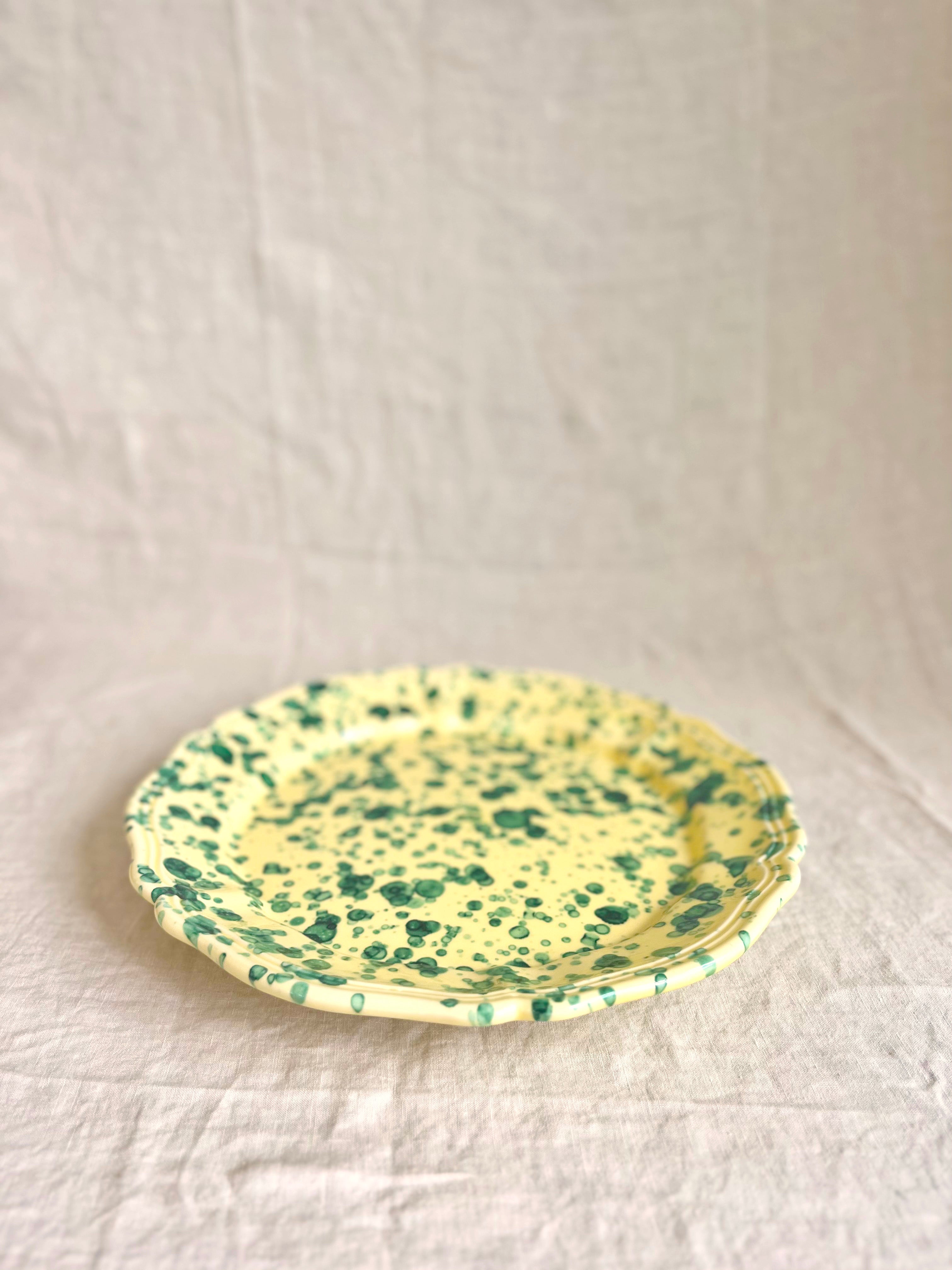 green and cream round spatterware platter side view