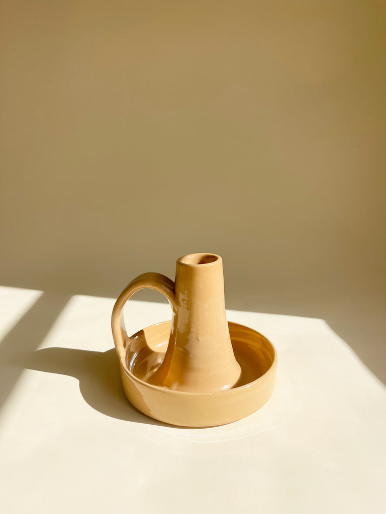 glazed ceramic taper candle holder in tan detail view