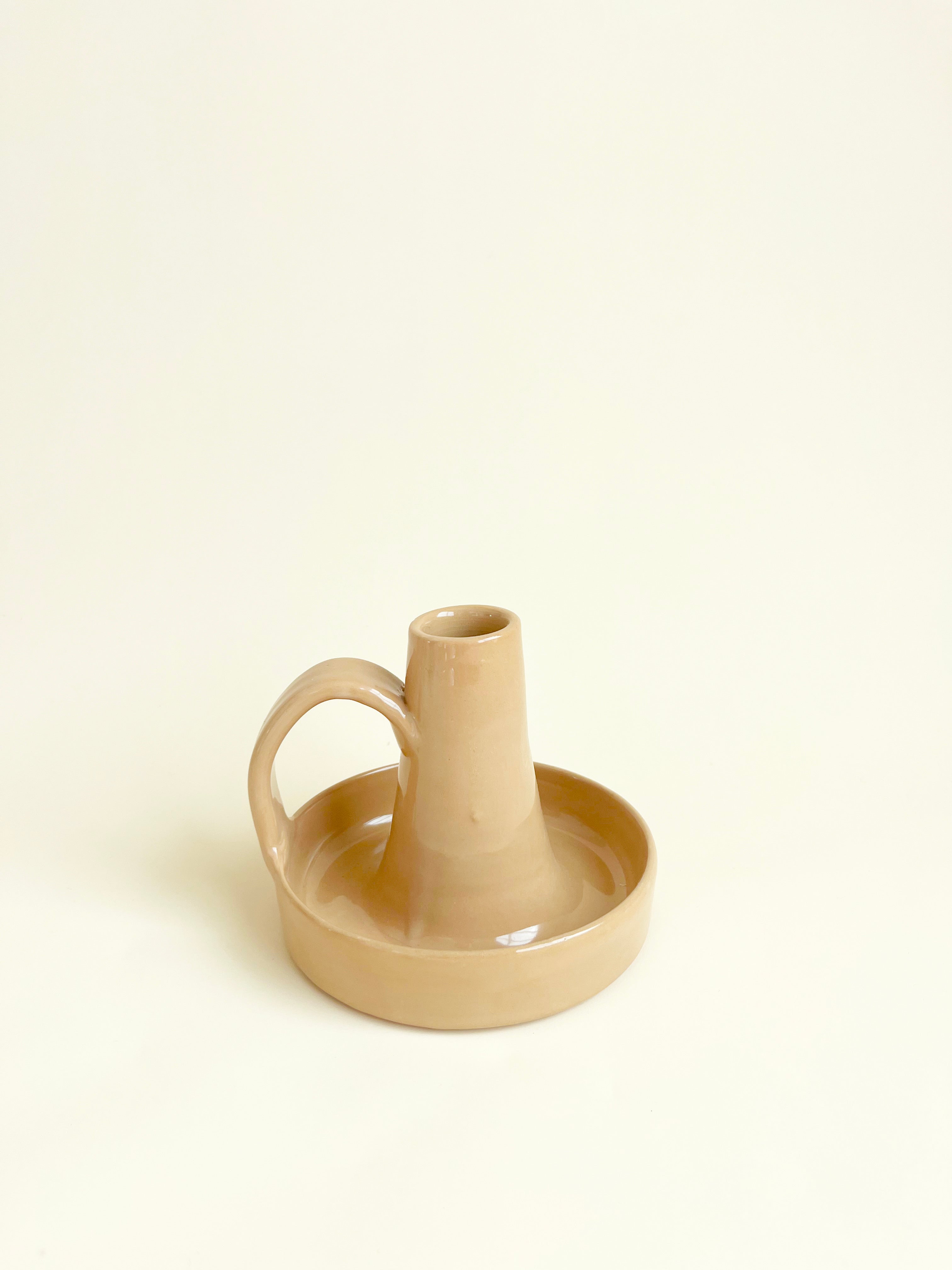 glazed ceramic taper candle holder in tan