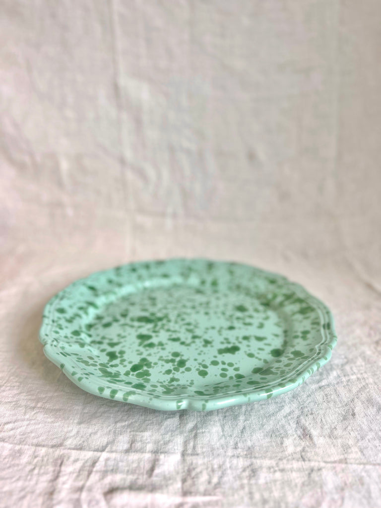 round green spatterware platter 14" side view