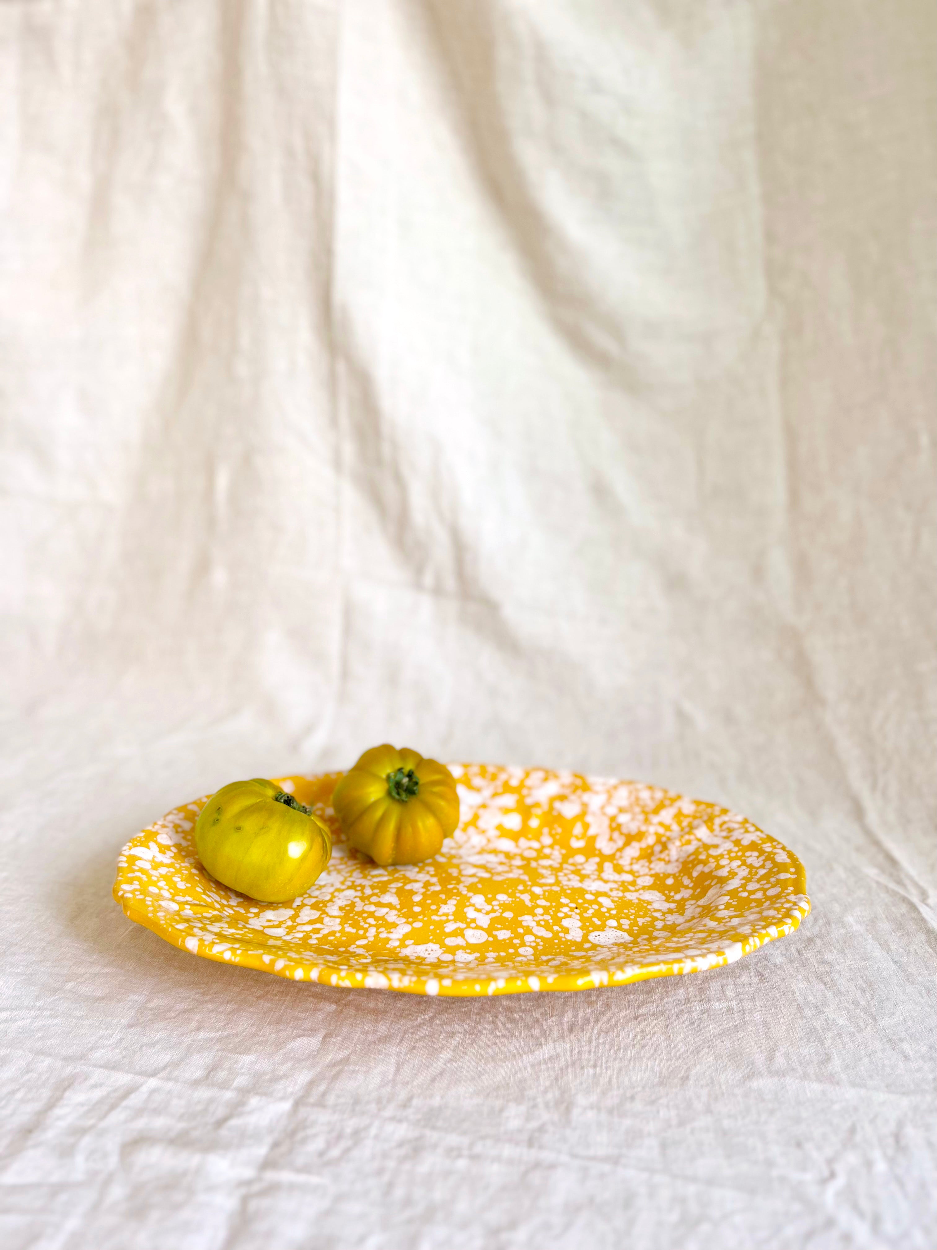 yellow and white oval spatterware platter 14" side view