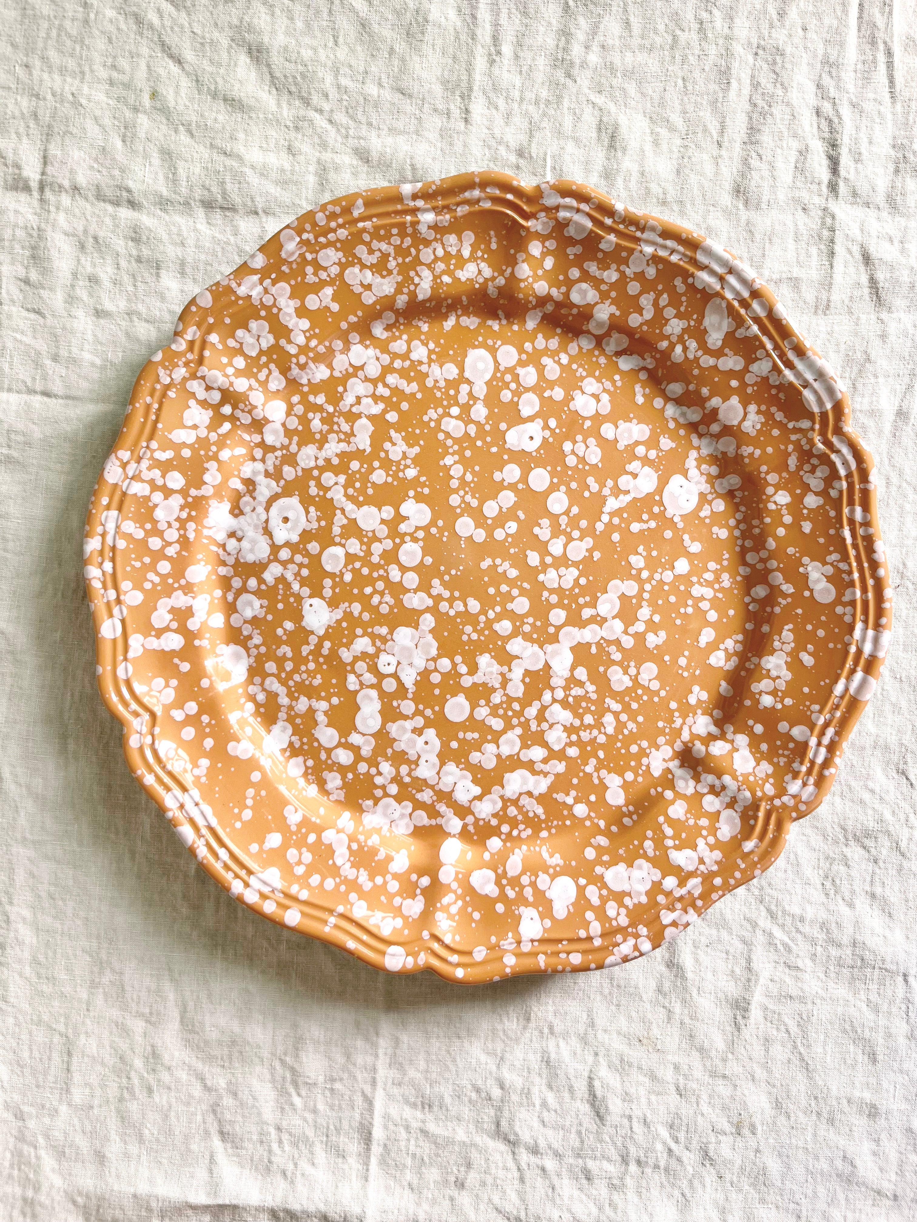 brown and white round spatterware platter 14"