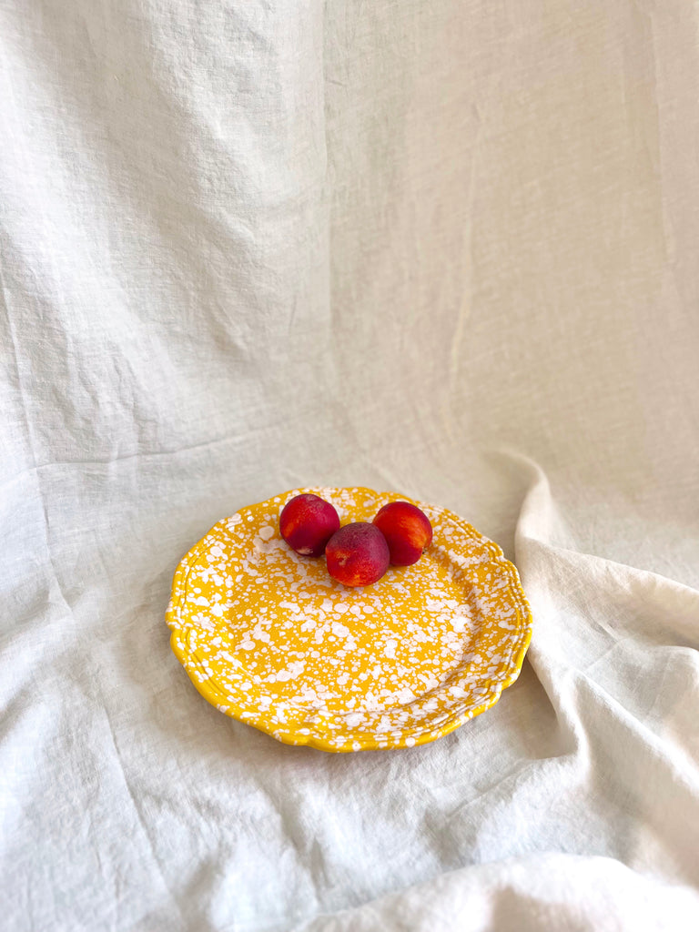 yellow and white round spatterware platter 14" with peaches