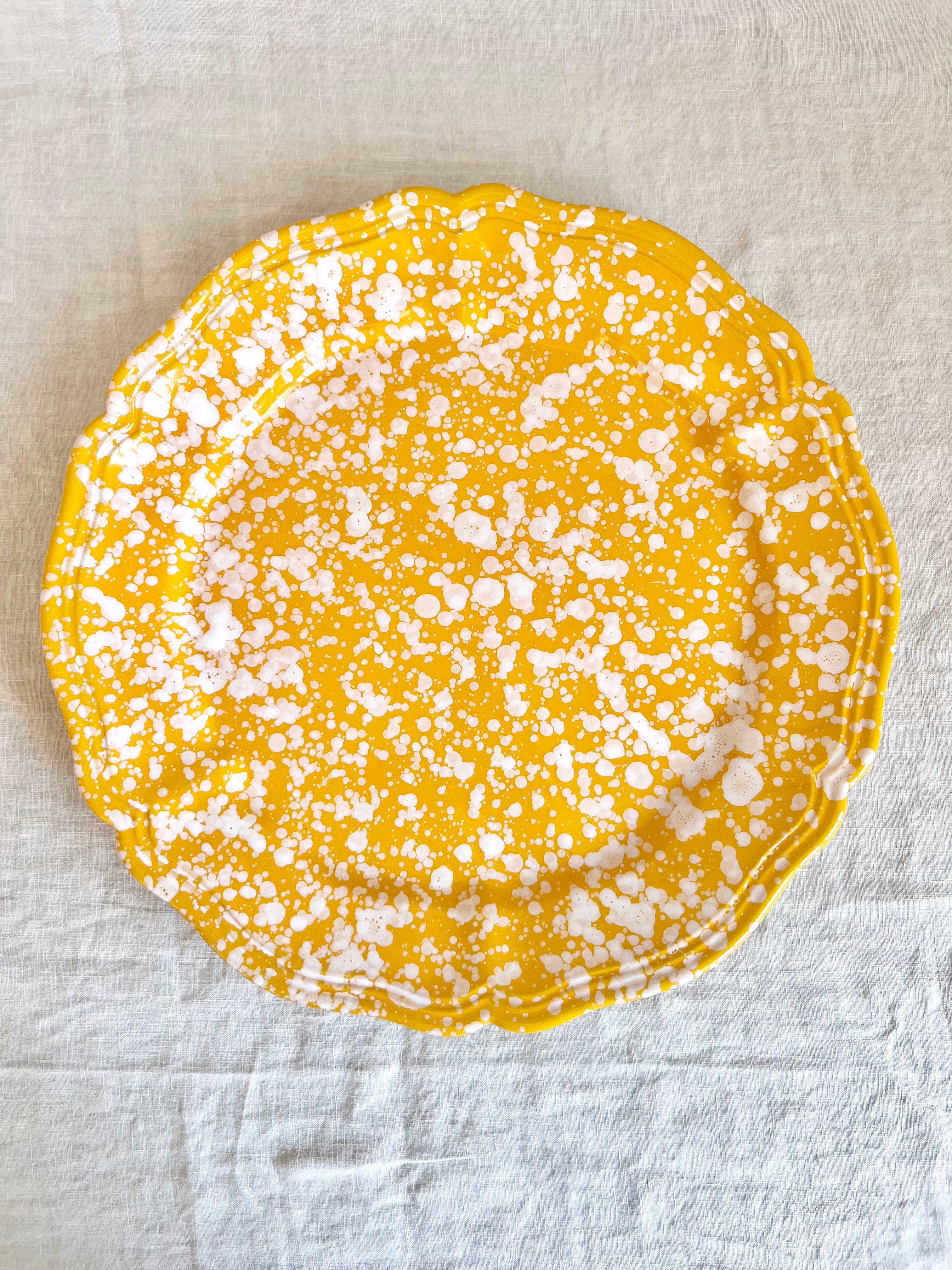 yellow and white round spatterware platter 14"