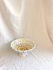 white hand painted compote bowl on white cloth