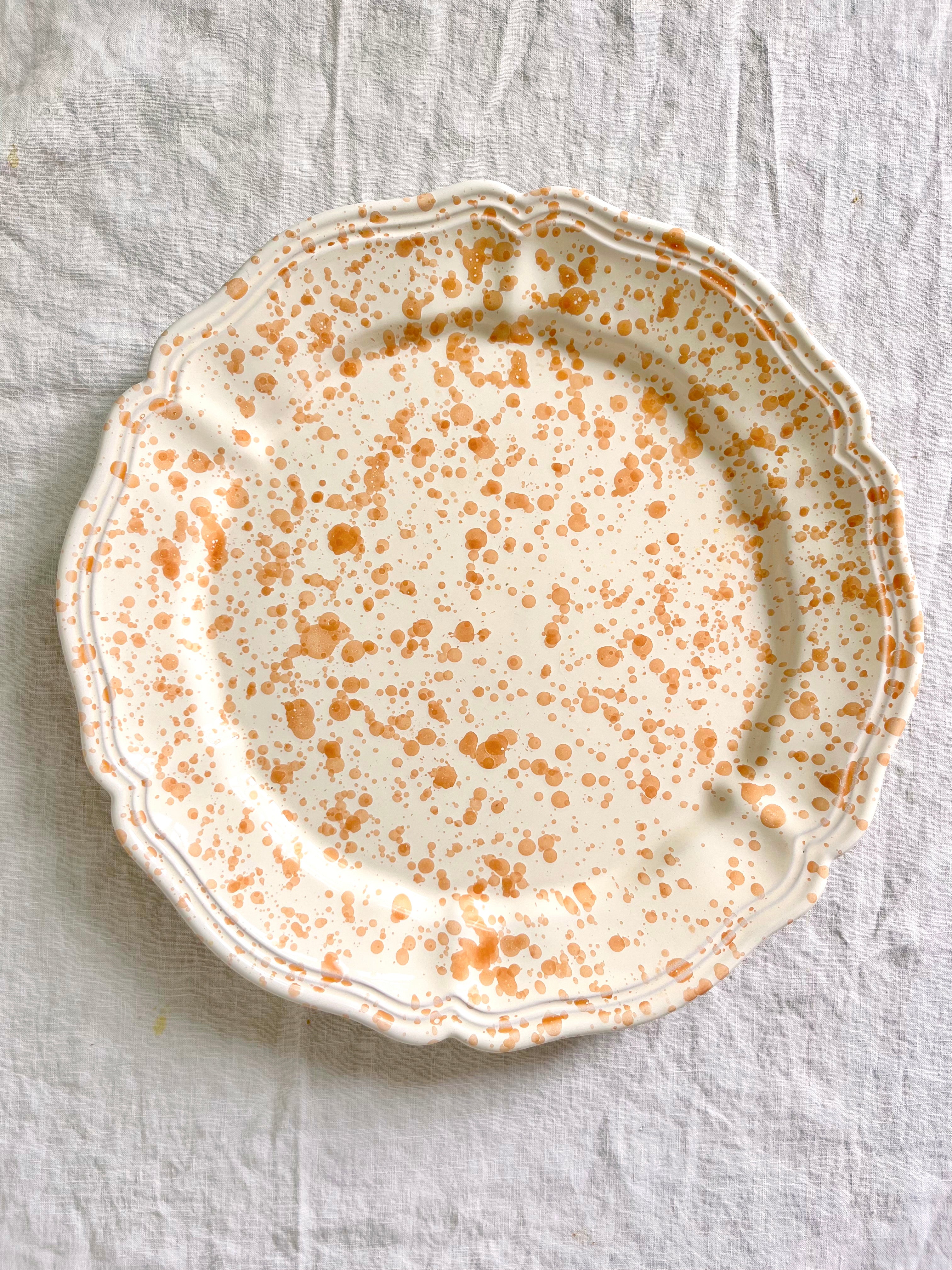 brown and white round spatterware platter 14"