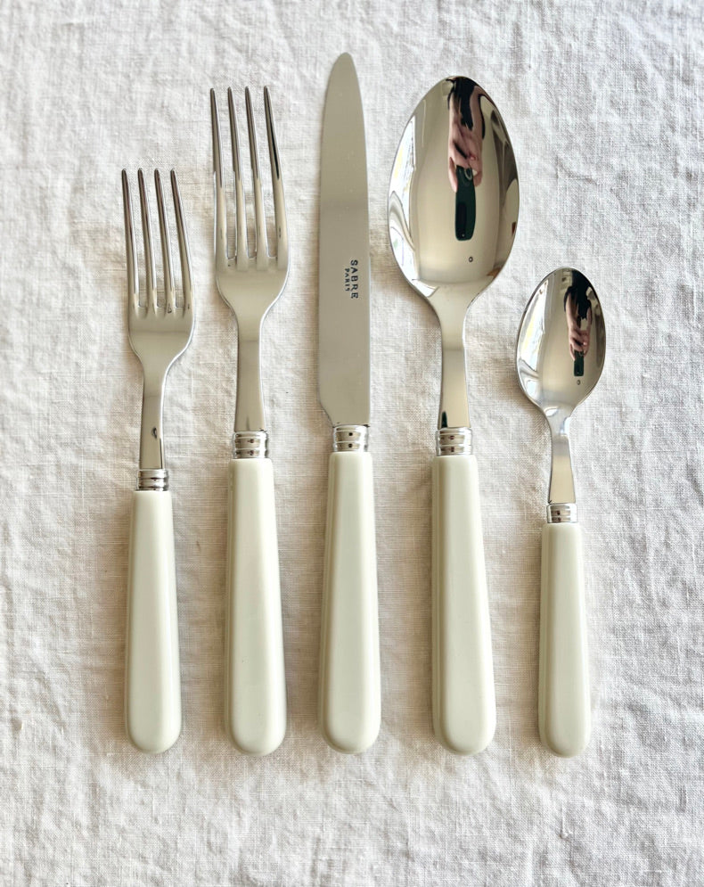 sabre stainless steel flatware set with white resin handle