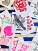 block print hand made card black and white bird with pink flowers 7.25" by 10" on striped tablecloth