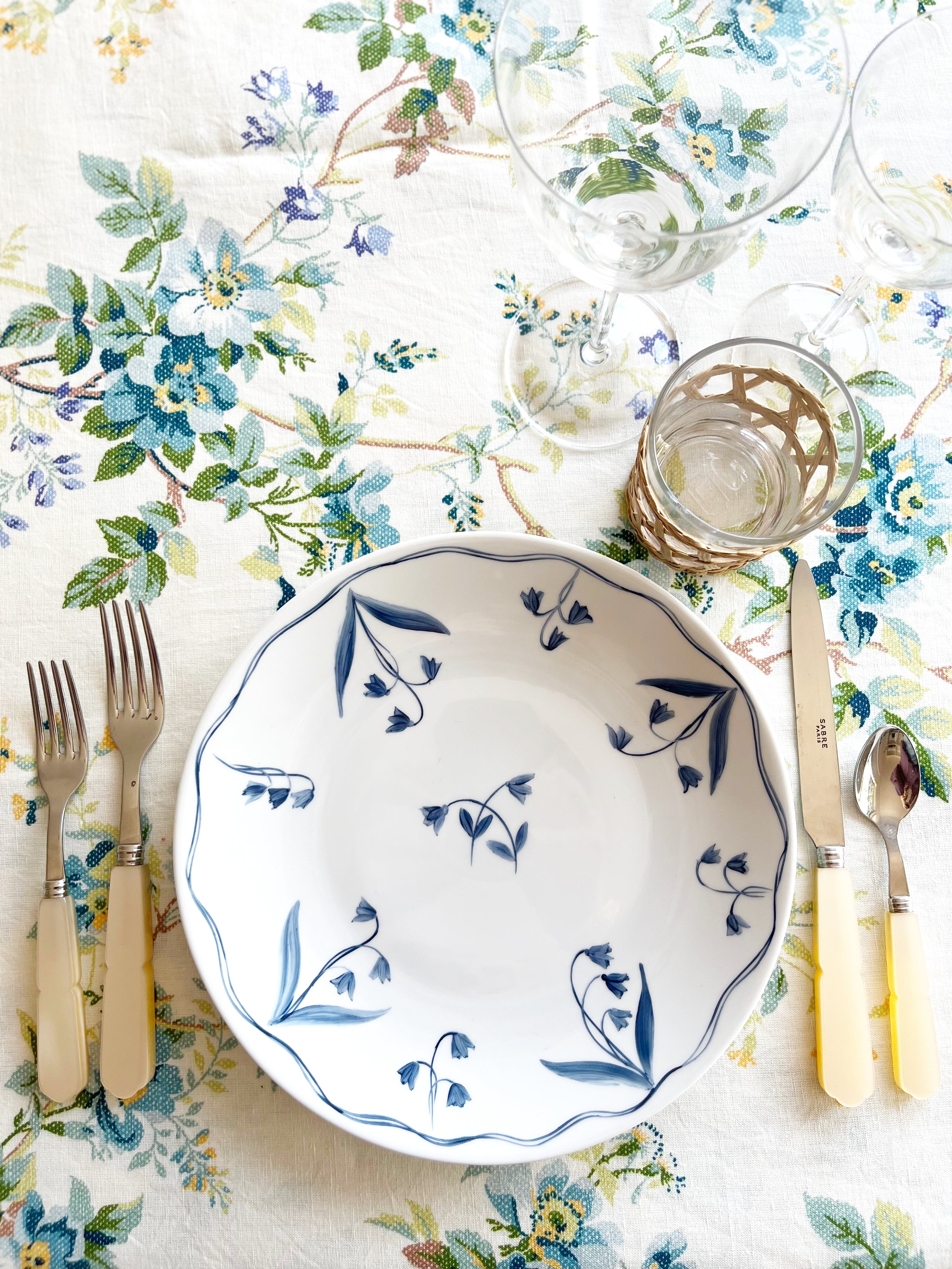 blue and white floral hand painted limoges porcelain dinner plate with placesetting