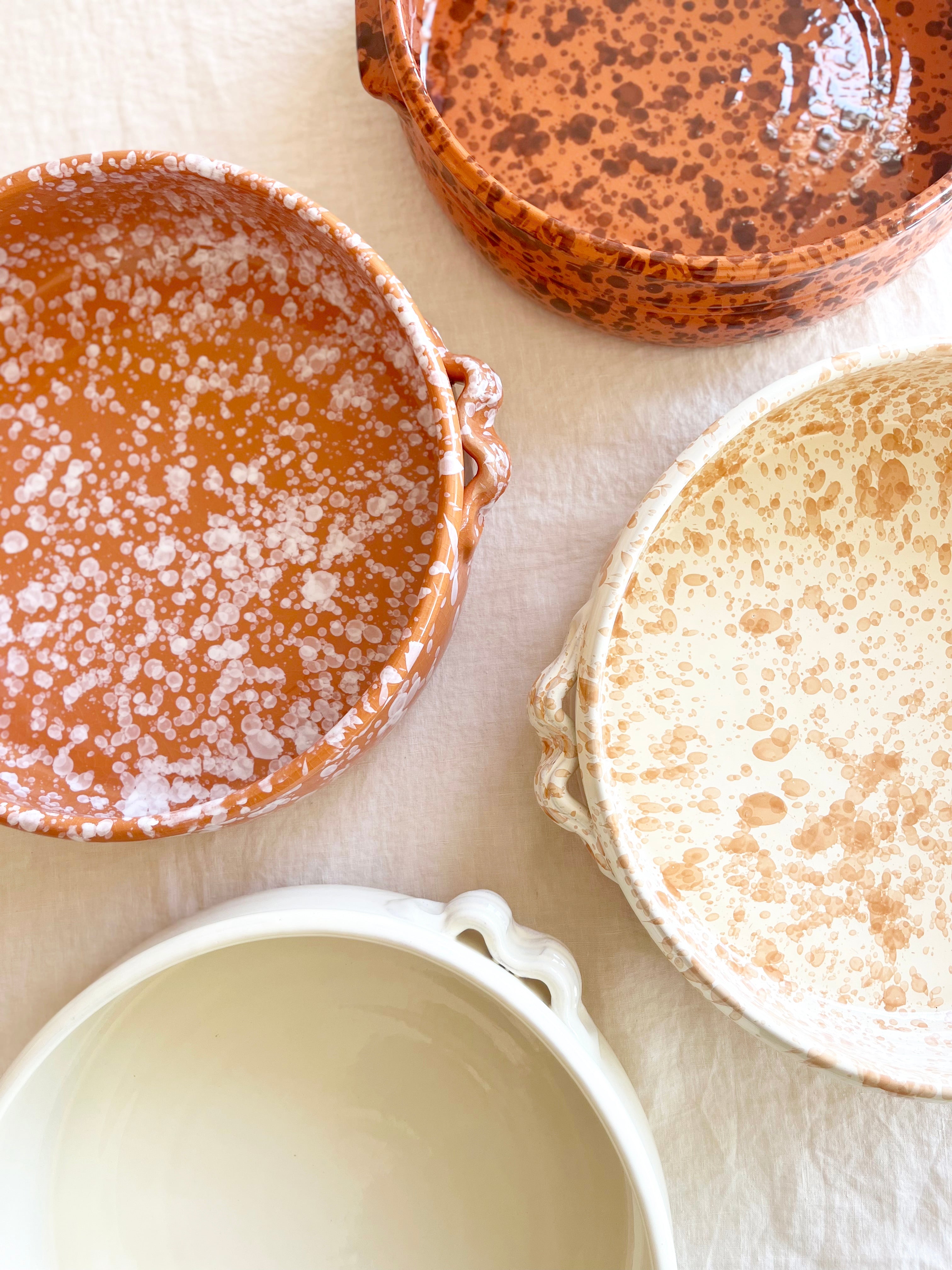 brown round oven safe dish with white speckle pattern speckle pattern 12.5" diameter top view