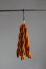 twisted candles by wax atelier clementine tapers hanging on hook