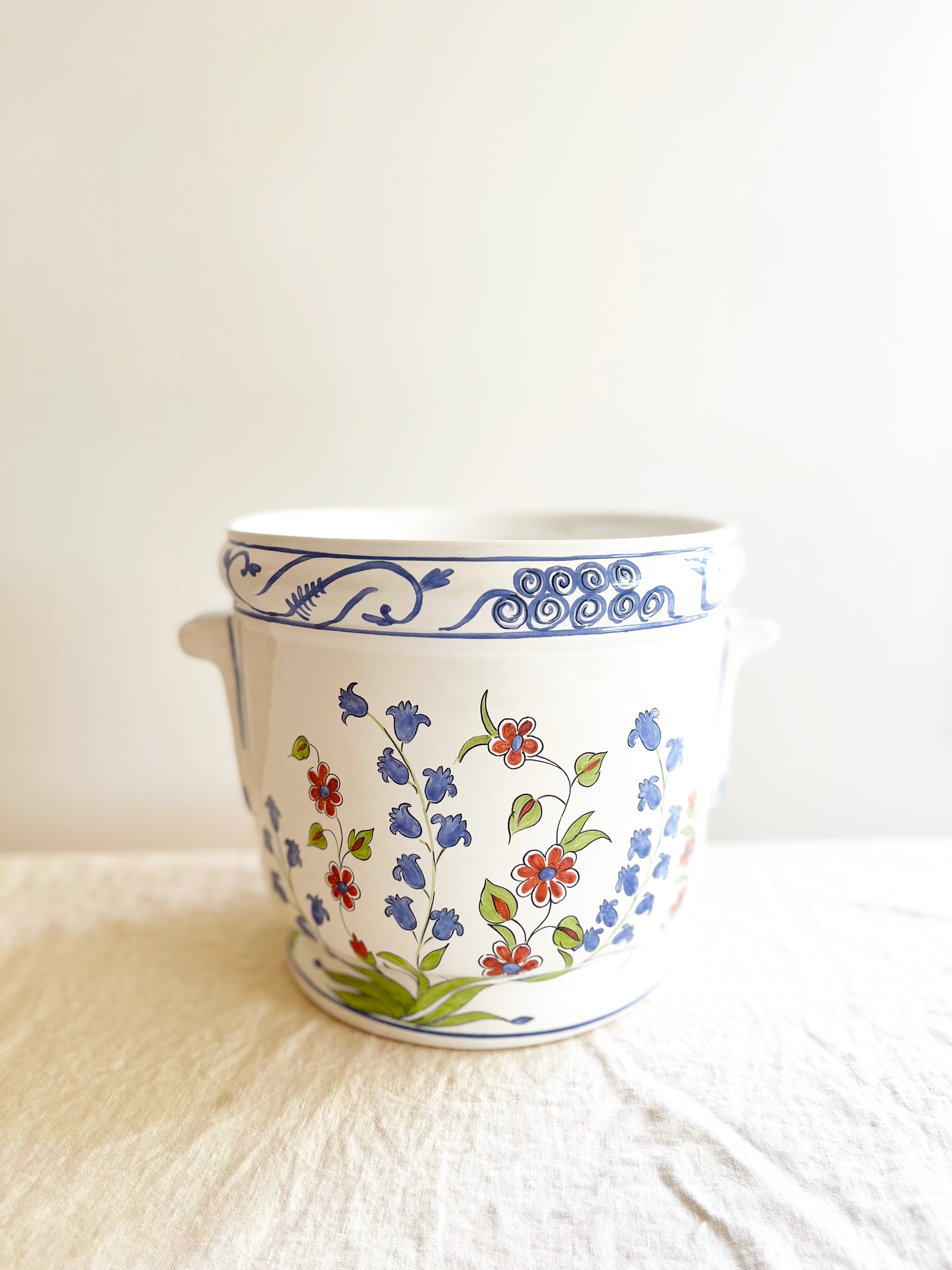 jardiniere planter with blue and pink floral pattern