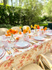 linen tablecloth with red climbing rose pattern in tablescape