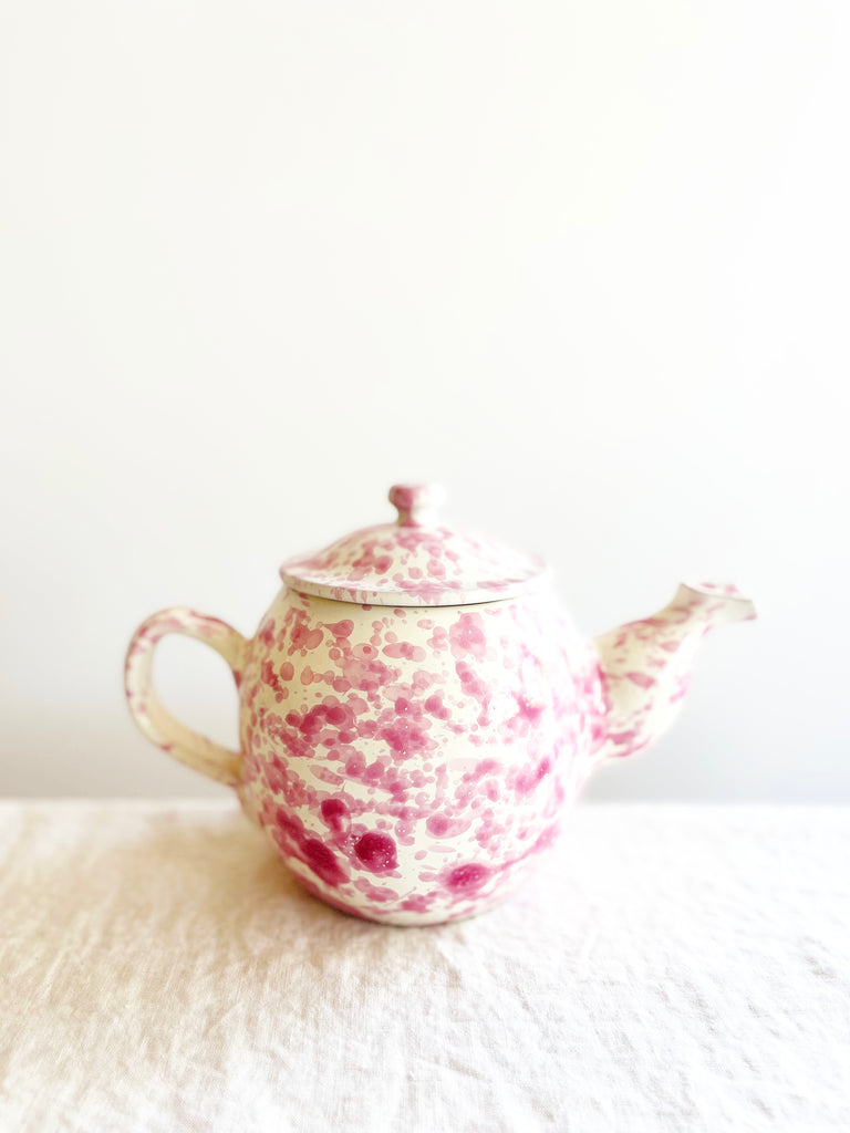 white teapot with pink splatter pattern
