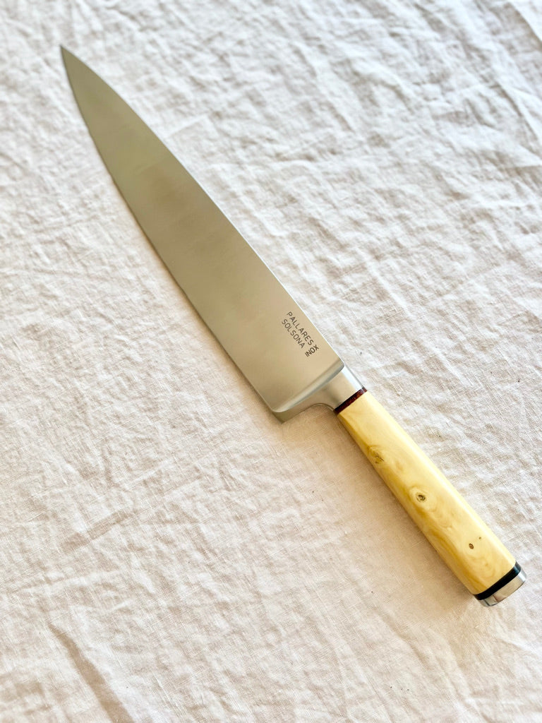 chef knife with boxwood handle diagonally on table by pallares solsona 25cm
