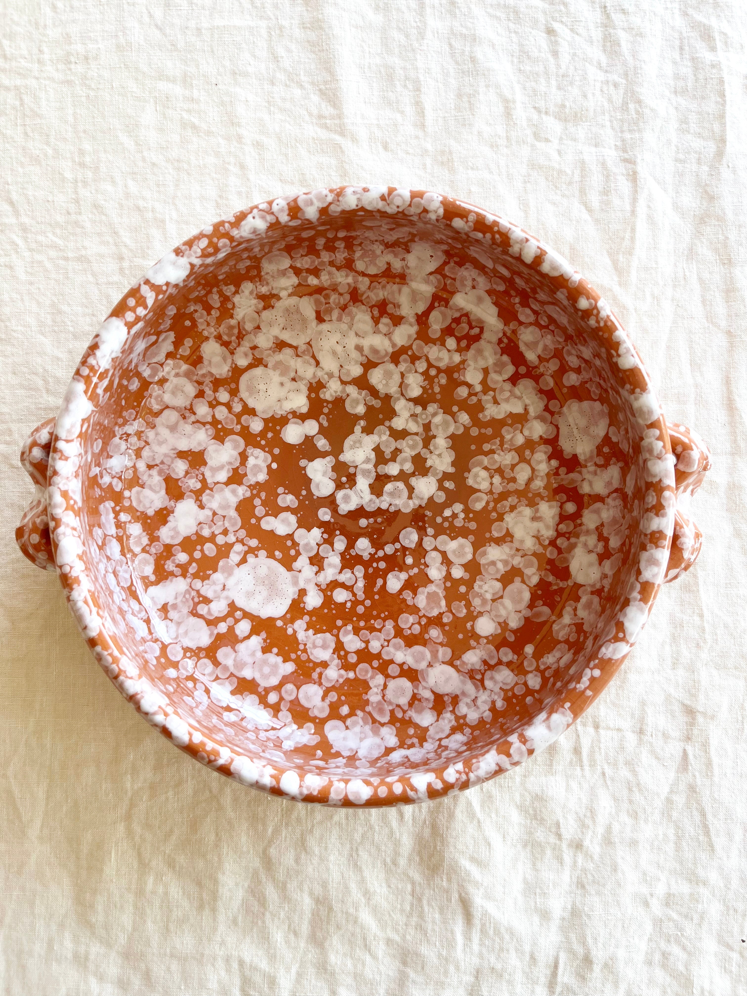 brown oven safe dish with cream speckle pattern 9" diameter top view