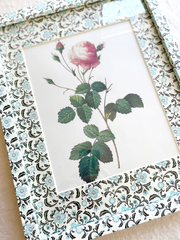 aqua black and white print paper wrapped frame and mat with pink rose botanical print 12" by 15" detail view