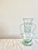 clear glass vase with two handles 14 inches tall on white table