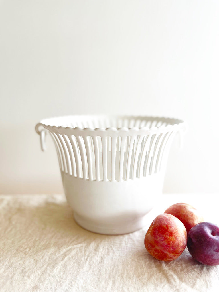 white openwork planter on table