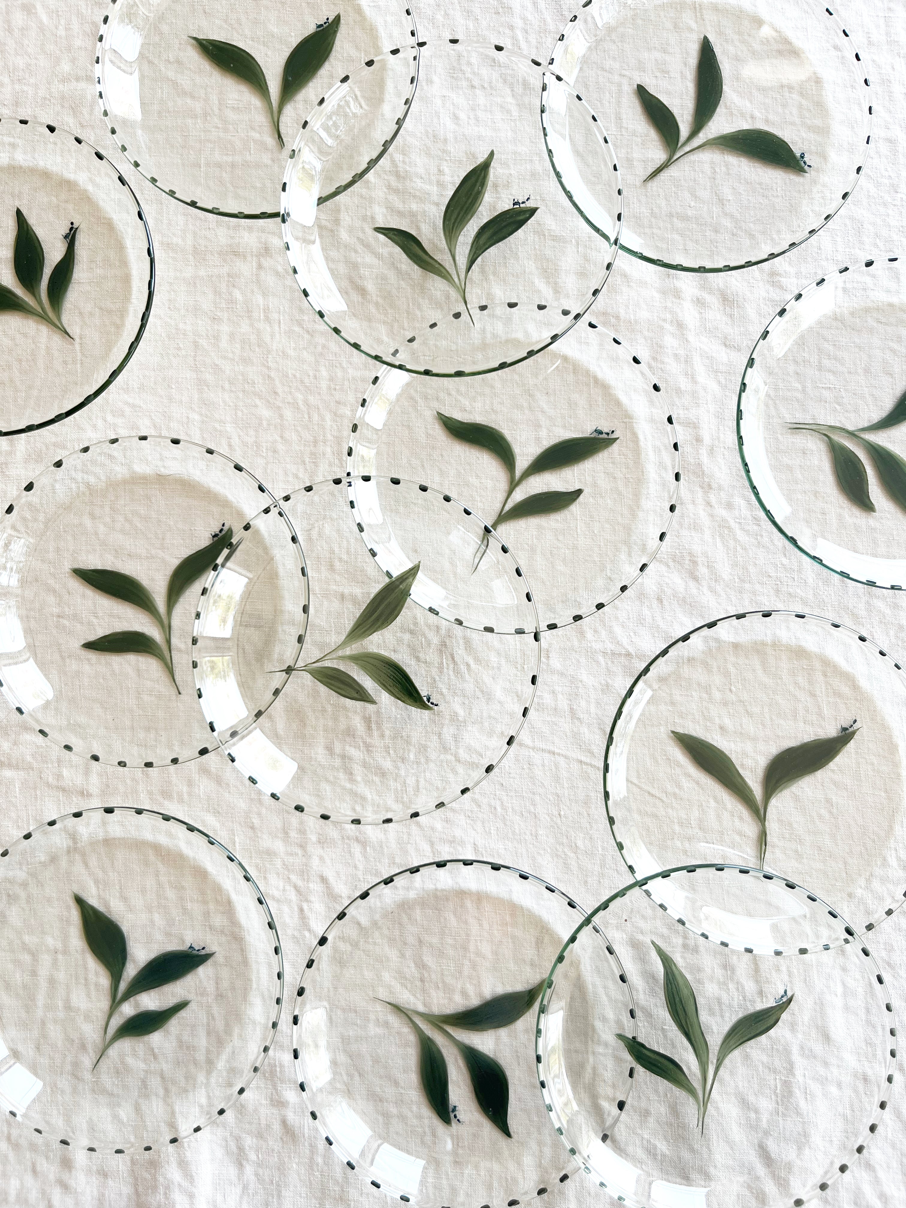 clear glass bread plate with hand painted green leaf with small ant in group