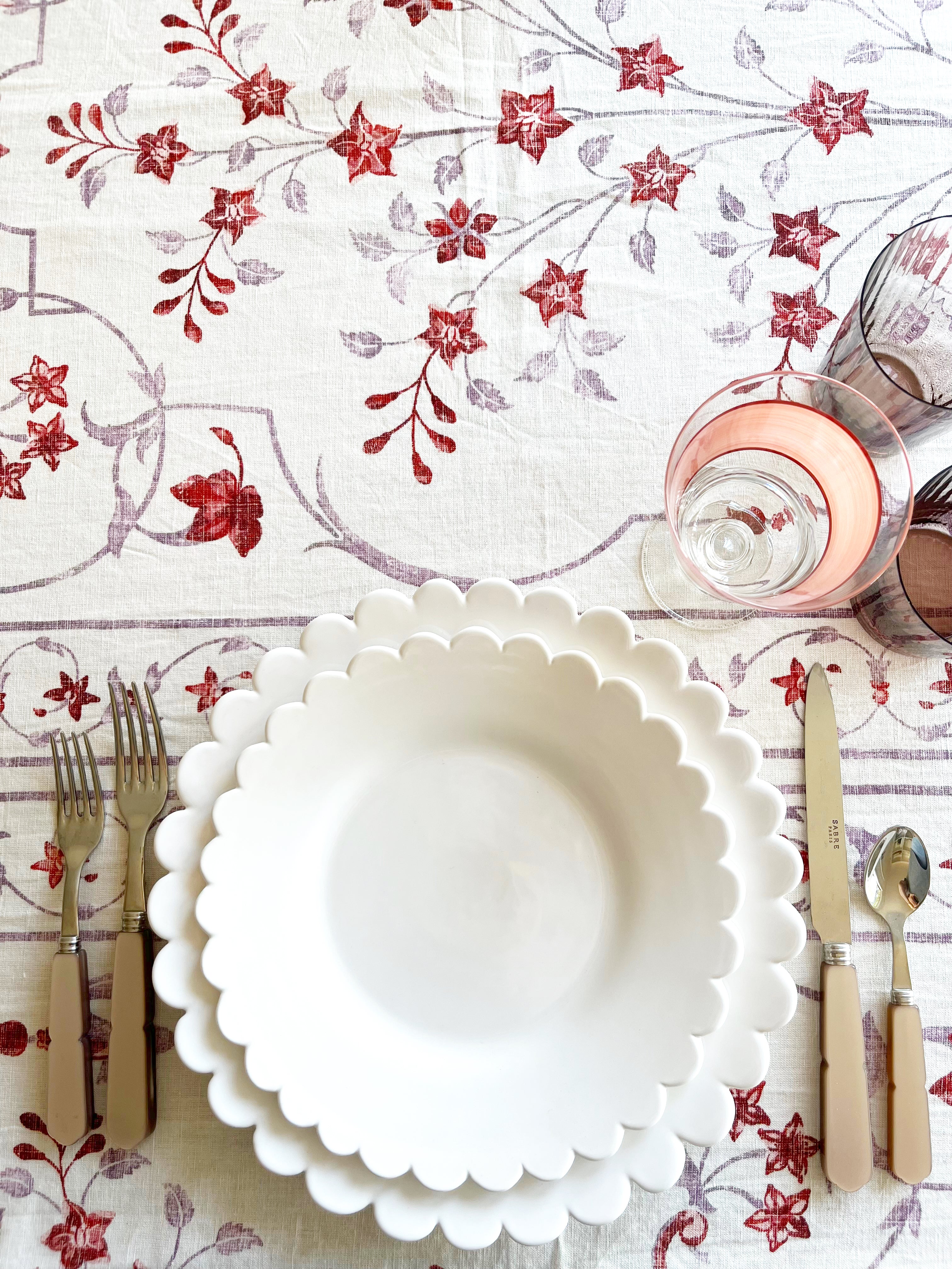 hand painted white salad plate with scalloped edge in place setting