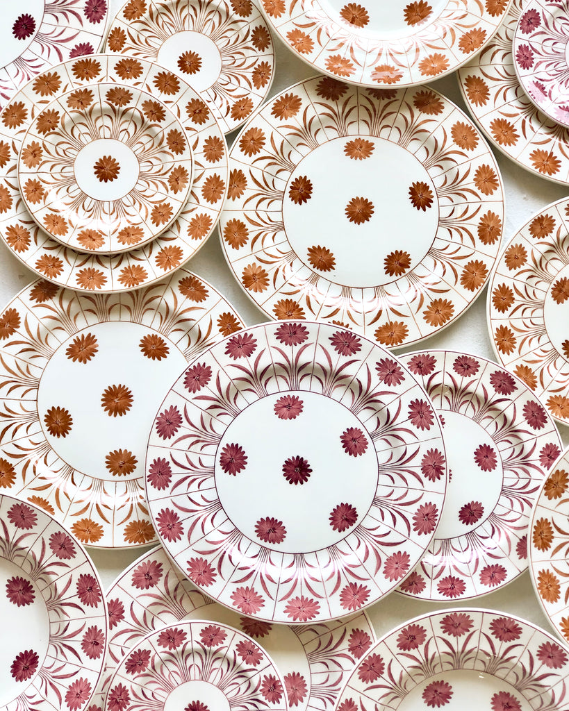 white ceramic salad plate with brown daisy pattern in group with other color options