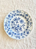 Meissen vintage blue and white porcelain luncheon plate with floral pattern on linen tablecloth