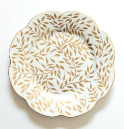 hand painted limoges porcelain bread plate with gold vine pattern and gold rim on white table