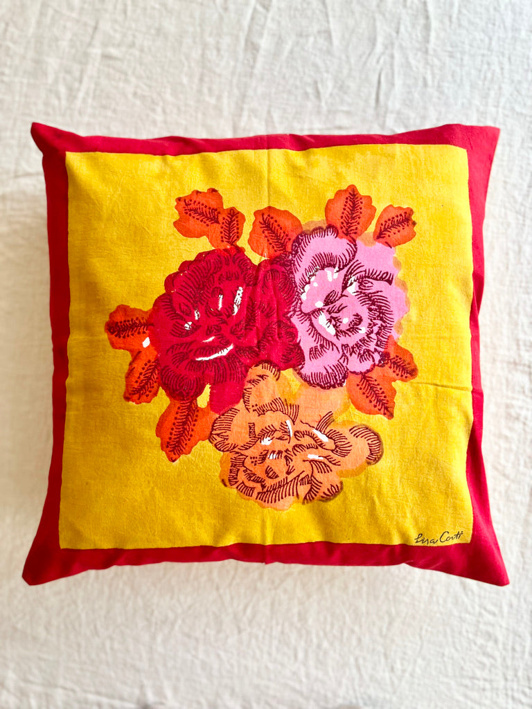 red and gold throw pillow cover with red and pink bouquet on one side 23.5 inches square