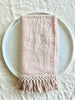 ballet pink linen napkins with fringed edge 18 inches square folded on plate