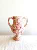 small white amphora vase with pink speckle pattern 8.25 inches tall