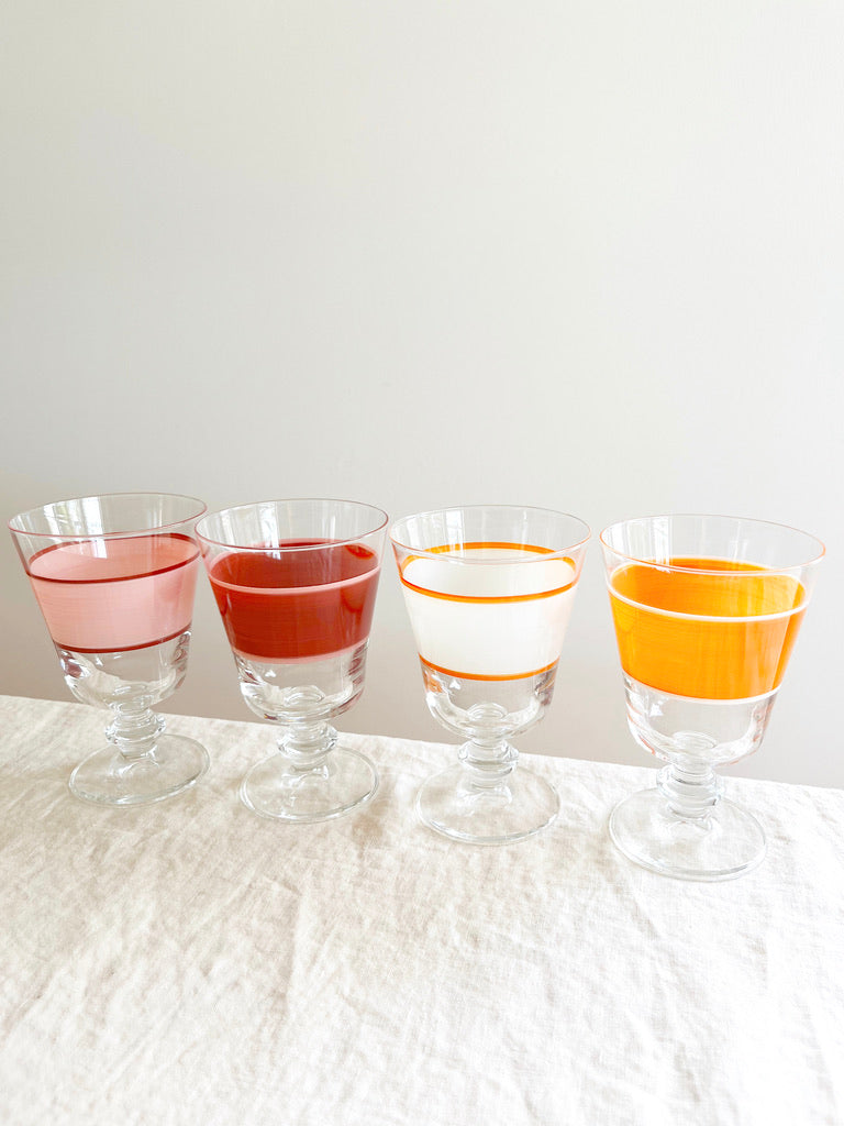 hand painted wine glass with peach and red stripe with other colors