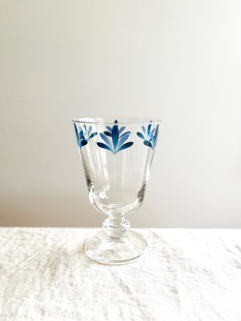 hand painted wine glasses with blue leaf pattern flower at rim
