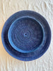 blue round woven tray fourteen inches nested with larger tray
