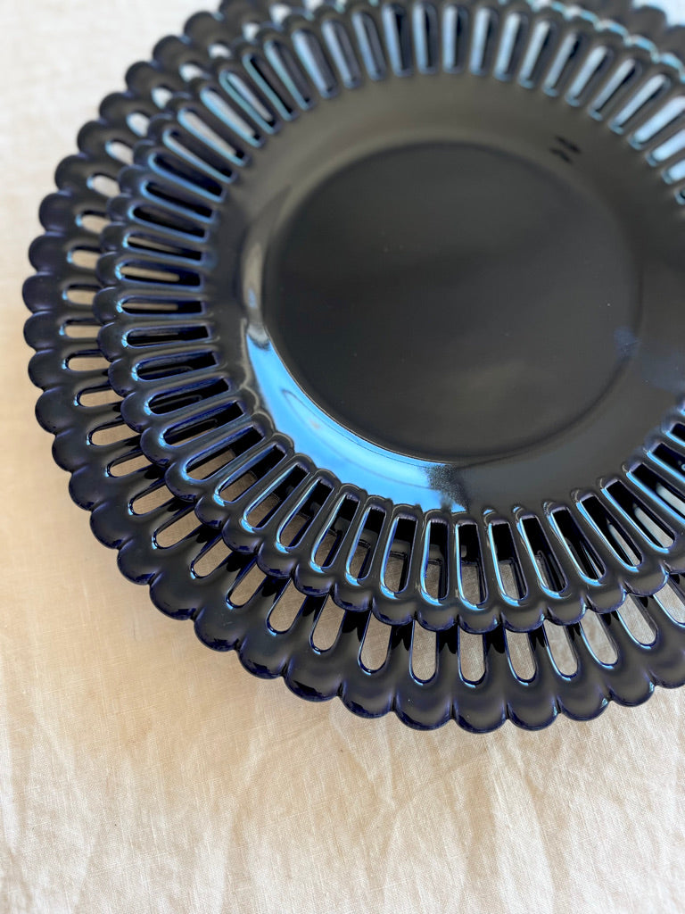 dark blue salad plate with openwork rim and scalloped edge detail view