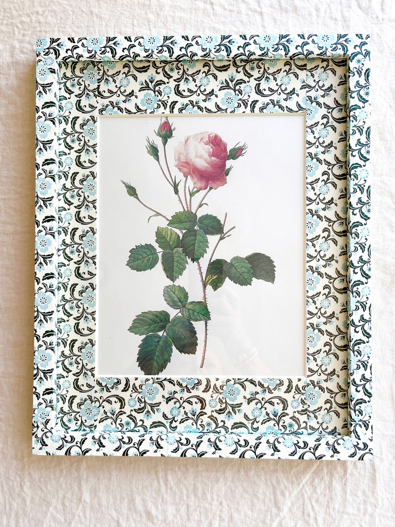 aqua black and white print paper wrapped frame and mat with pink rose botanical print 12" by 15"