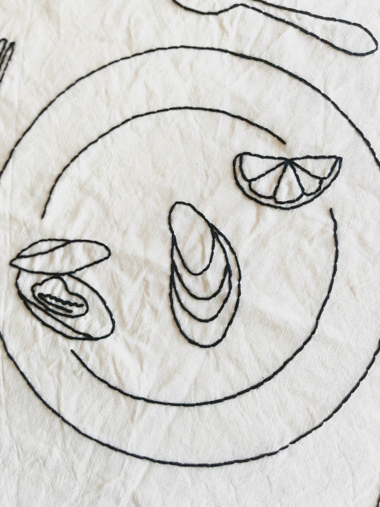 Oyster Embroidered Linen Placemat close up to plate