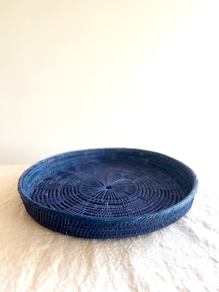 blue round woven tray fourteen inches side view