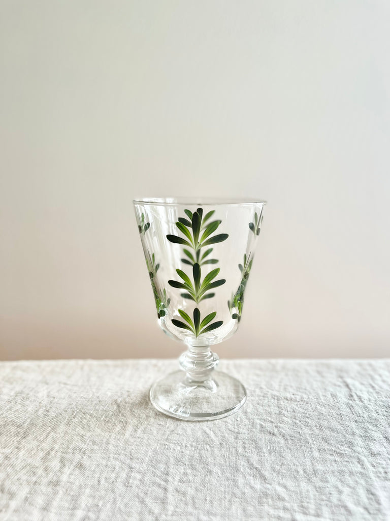 hand painted wine glasses with dark green leaf pattern detail view