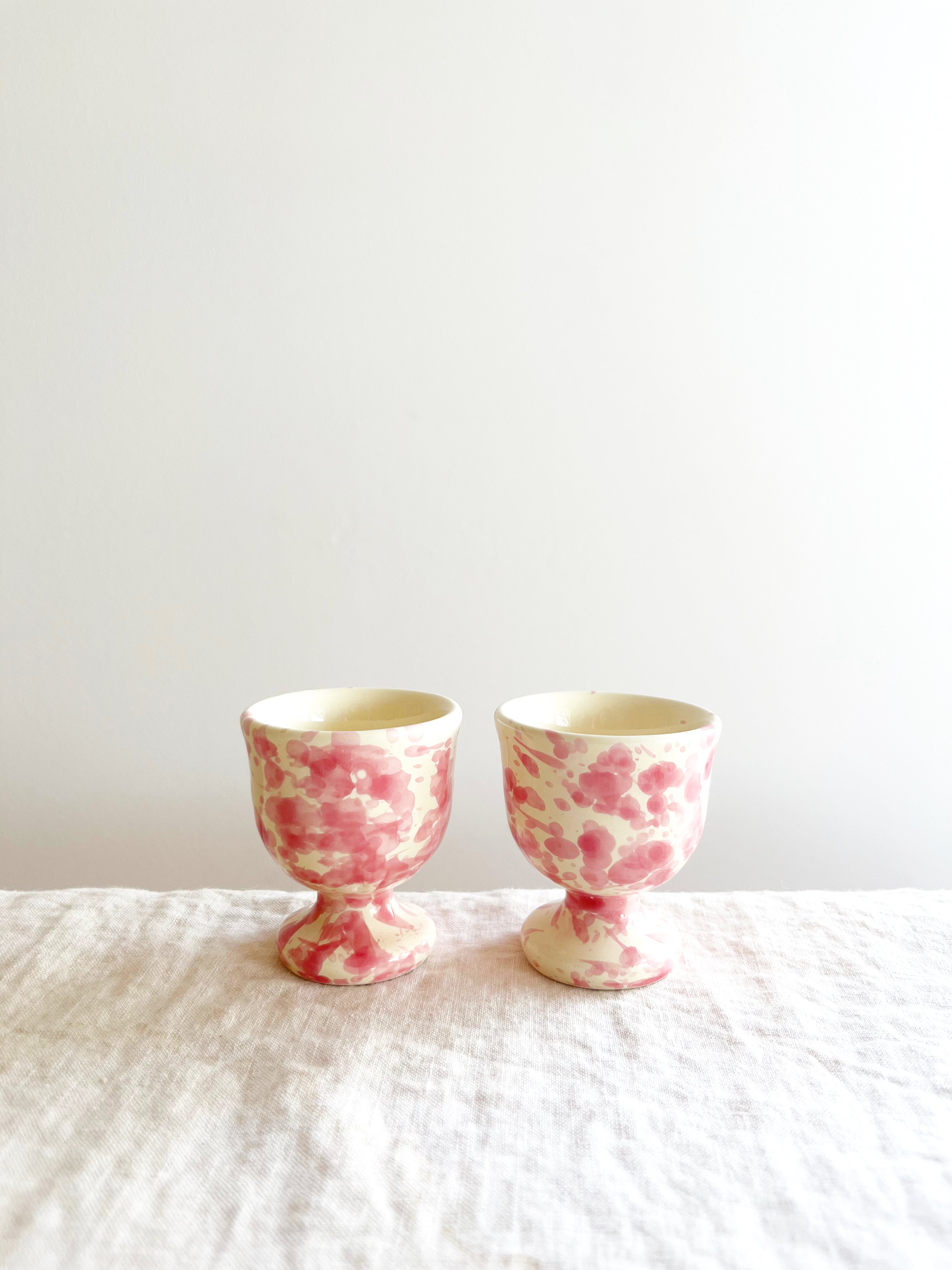 cream egg cups with pink splatter pattern 2 inches in diameter