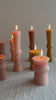assorted totem candles green wine light pink on table with flame video