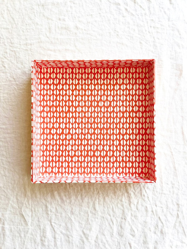 square red orange paper tray with white geometric print 8 inches