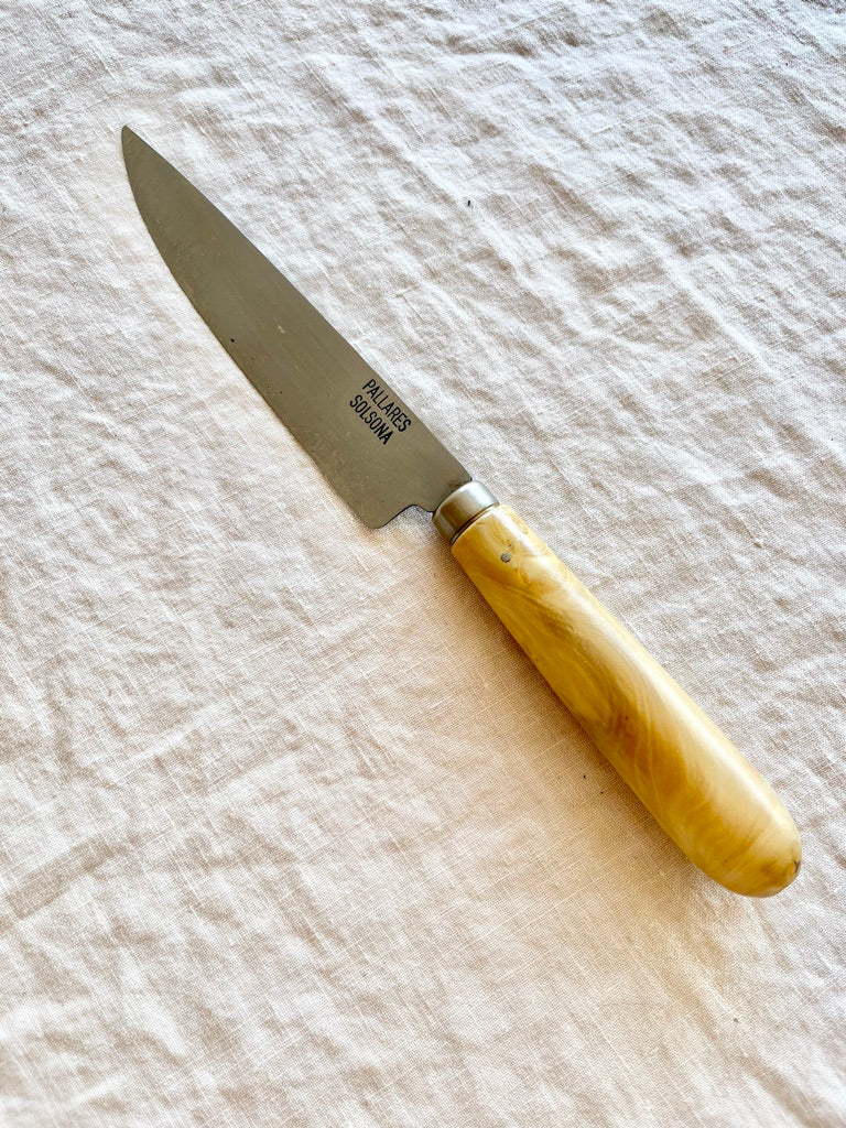 kitchen knife with boxwood handle by pallares solsona carbon steel 12cm diagonal on table