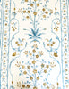 white tablecloth with blue and brown floral pattern flower detail view